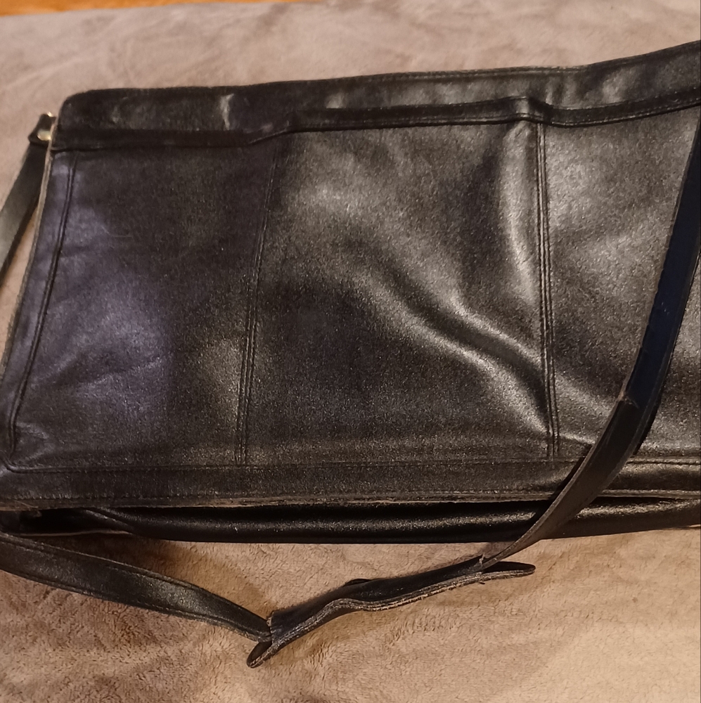 Leather briefcase bag with shoulder strap and handles that hide away vintage